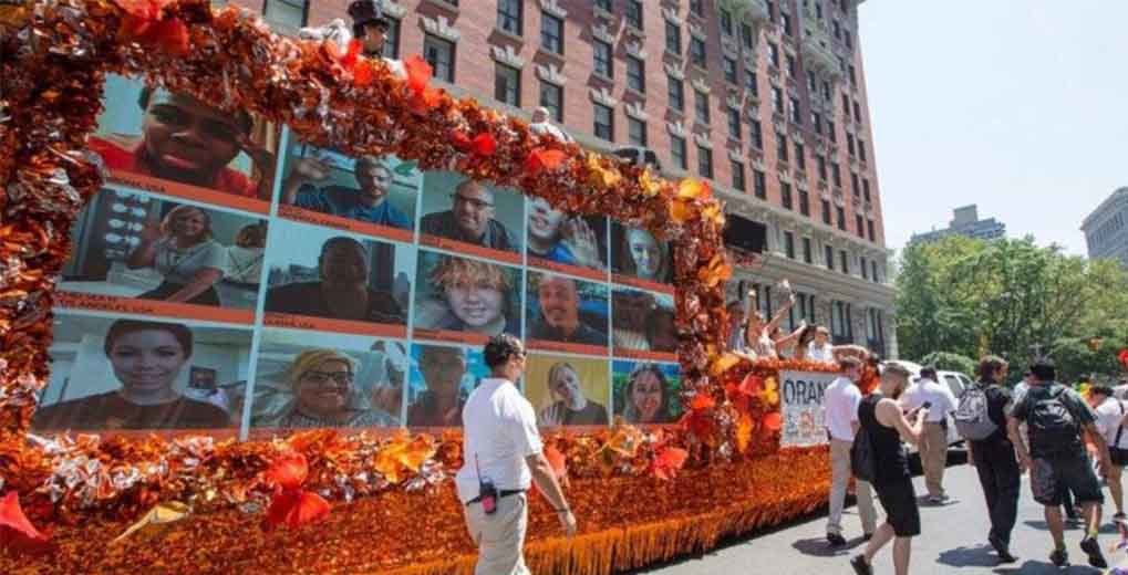 Orange parade float with Fan Filter images on the side